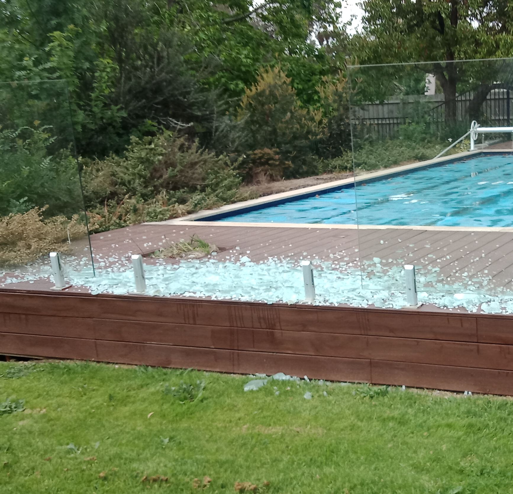 A broken poolside glass panel